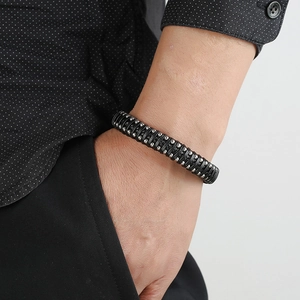Men's braided black leather bracelet with silver metal beads and magnetic buckle