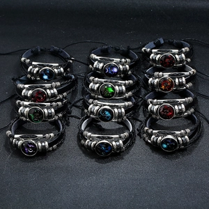 Set of 12 zodiac multi-layer braided leather bracelets with luminous glass symbols