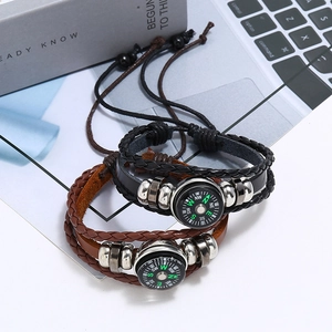 Handcrafted multi-layer braided leather bracelet featuring a vintage compass and metal beads