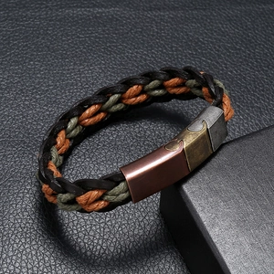 Macro shot of vintage braided leather bracelet with multi-color cords and magnetic clasp