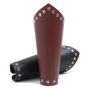 Close-up of punk leather wristbands with metal rivets and orange contrast stitching