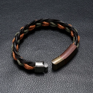 Braided leather punk bracelet with magnetic metal clasp on textured black leather base