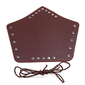Brown punk leather bracer with decorative metal rivets and adjustable lacing cords