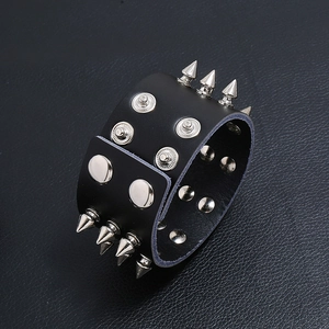 Punk rock style black leather wide bracelet with silver spikes and metal studs