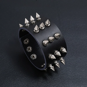 Punk style cowhide bracelet with three rows of silver spikes and metal snap buckle