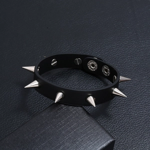 Punk style black leather bracelet with silver metal spikes and adjustable snap buttons