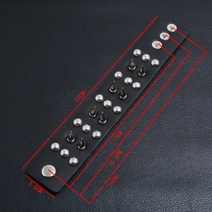 Detail of punk leather bracelet with silver metal spikes and adjustable snap buttons