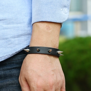 Men's punk black leather wristband with silver metal cone studs and edgy rock style