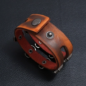 Vintage brown leather cuff bracelet with metal rivets and industrial distressed finish