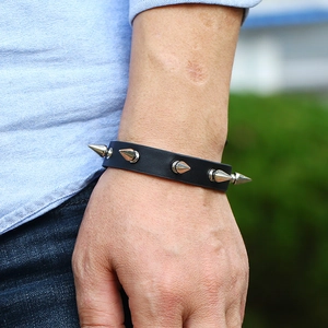 Punk rock black leather bracelet with silver metal conical spikes for a gothic look