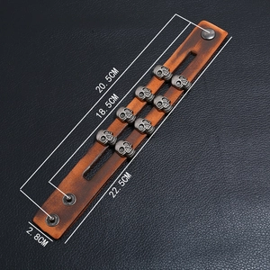 Detailed size specifications of a double-row skull leather bracelet with metal snap buttons