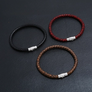 Three braided leather bracelets in black, red, and brown with polished silver metal clasps