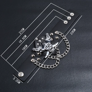 Punk leather bracelet featuring pirate skull charms, chunky chain, and adjustable snaps