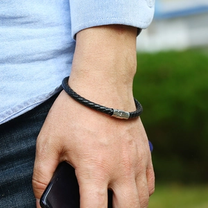 Men's minimalist black braided leather bracelet with silver magnetic metal clasp