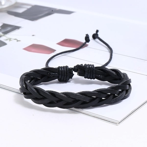 Detail of multi-strand braided black leather bracelet with adjustable drawstrings