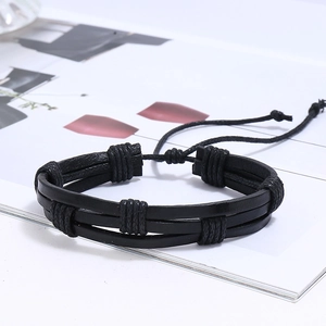 Close-up of black multilayer leather braided bracelet with adjustable drawstrings