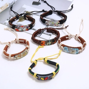 Set of six vintage braided leather bracelets with adjustable ropes and punk metal charms