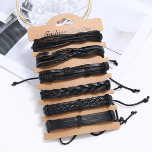Ethnic style 6-piece black woven leather bracelet set displayed on a kraft card