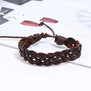 Detail of hand-woven dark brown leather bracelet with adjustable drawstring closure