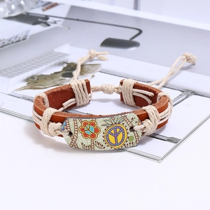 Detail of hand-woven leather bracelet with peace sign pattern and hemp rope texture