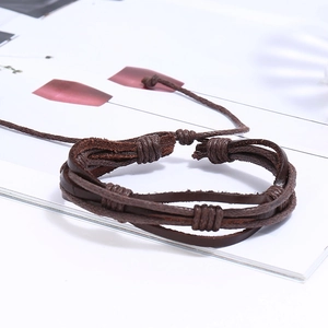 Detail of vintage braided leather bracelets with adjustable sliding knot closure
