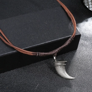 Retro bull horn pendant necklace on woven leather rope with vintage silver finish