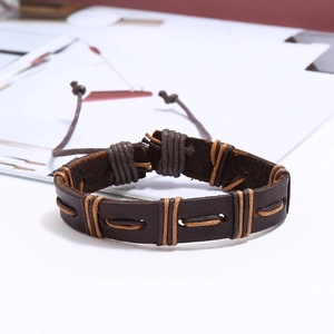 Detail of vintage braided leather bracelet showing handcrafted texture and adjustable cord