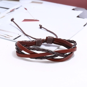 Close-up of a 5-piece multilayer punk leather bracelet with woven rope and adjustable cord