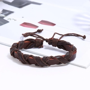 Detail of hand-woven dark brown leather bracelet with adjustable sliding knot closure