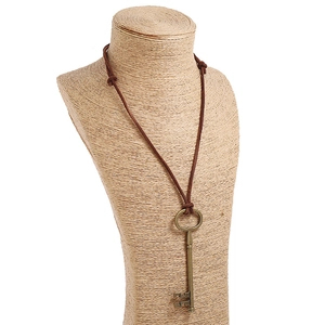 Retro punk style long necklace with a bronze key pendant and brown leather cord