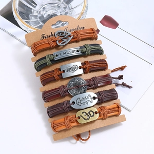 Set of 6 vintage braided leather bracelets with metallic charms and symbolic pendants