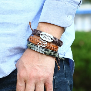 Three-piece retro woven leather bracelet set for men featuring a Fearless engraved metal plate