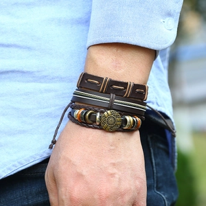 Men's retro multilayer leather bracelet set with brown woven cords and bronze metal disc