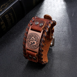 Bracelet vintage en cuir marron tressé avec plaque métallique symbole Om et boucle
