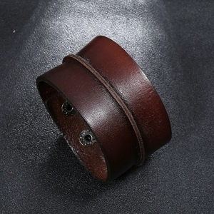 Retro wide dark brown leather bracelet for men featuring dual metal snap button closures