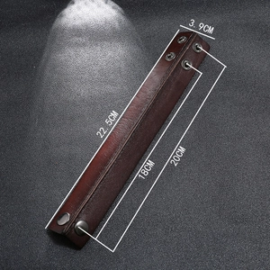 Detailed view of punk leather bracelet with dual snaps and 3.9cm width measurements