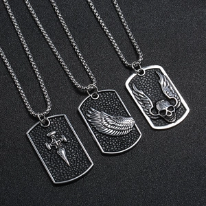 Three punk style stainless steel necklaces with skull, wing and cross dog tag pendants
