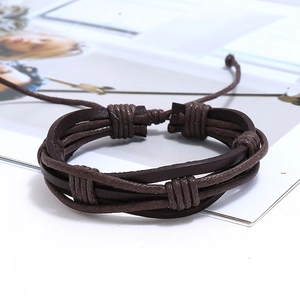 Close-up of brown multi-layer braided leather bracelet with adjustable sliding knot