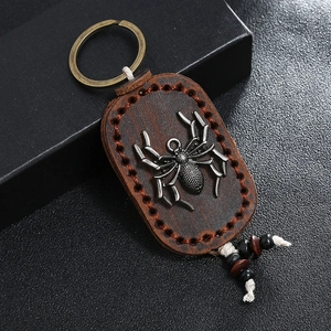 Vintage leather spider keychain with bronze ring and handmade punk style details