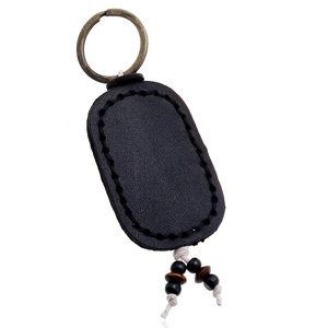 Handmade black leather oval keychain with vintage metal ring and bead accents