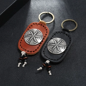 Handmade leather keychains with vintage metal star medallion and beaded tassels