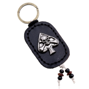 Vintage leather keychain with double-sided skull spade and cotton fringe tassel
