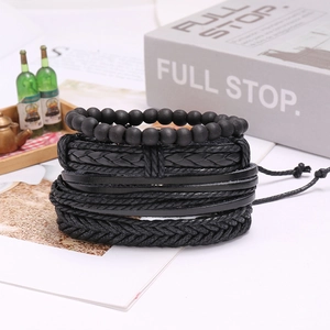 Set of four vintage black multilayer leather bracelets featuring beads and braided cords