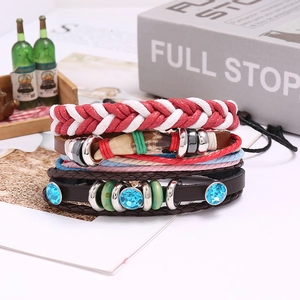 Detail shot of multi-layer bohemian leather bracelet with blue rhinestones and charms