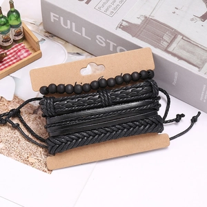 Detail of multi-layer black woven leather bracelet set on display card with beads
