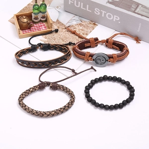 Retro 4-piece set of braided leather and beaded bracelets featuring Tai Chi Yin Yang charm