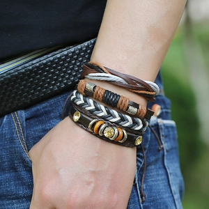 Set of four vintage multilayer leather bracelets with braided cords and amber crystal accents