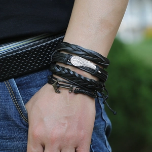 Men's retro layered leather bracelet featuring wing and anchor charms in punk style
