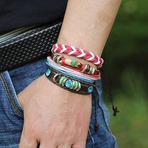 Retro multi-layer braided leather bracelet set with blue rhinestones on a female wrist
