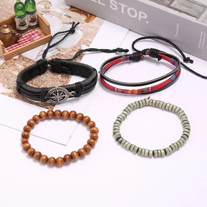 Set of four vintage braided leather and wooden bead bracelets with a compass metal charm
